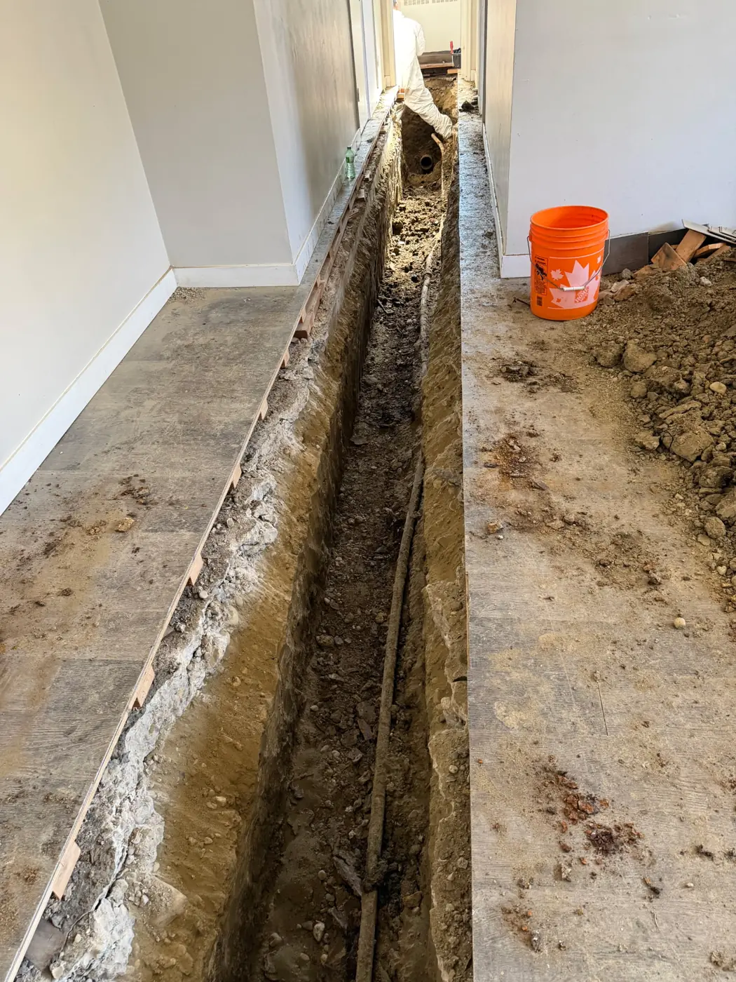 Trench cut through the slab along the run