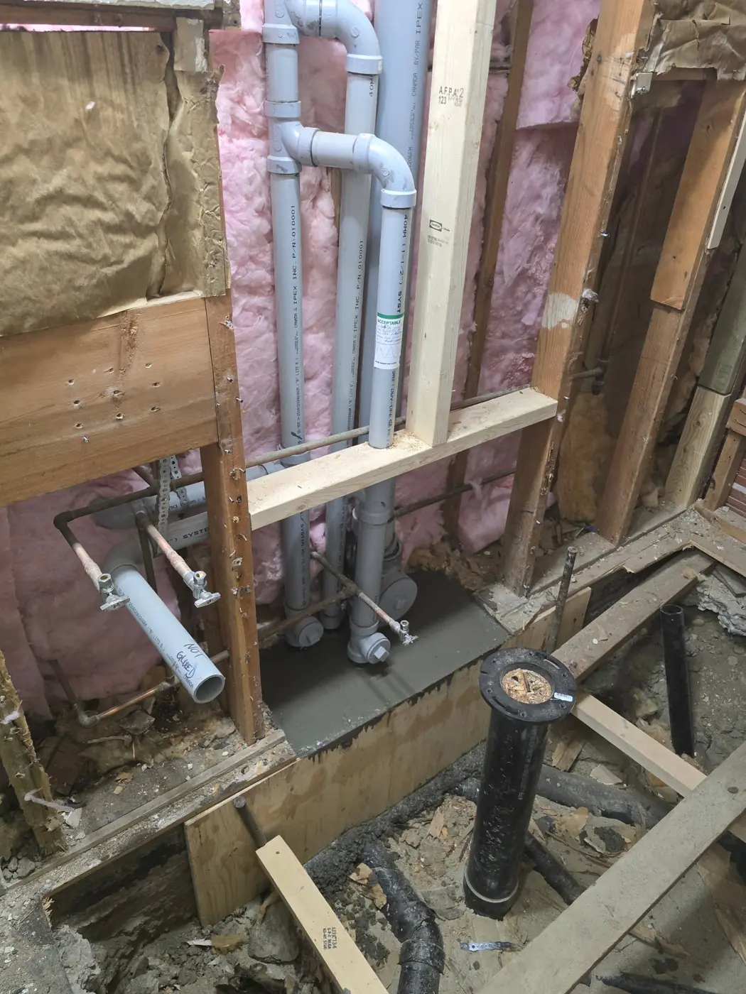 New drain stack roughed in, slab patched