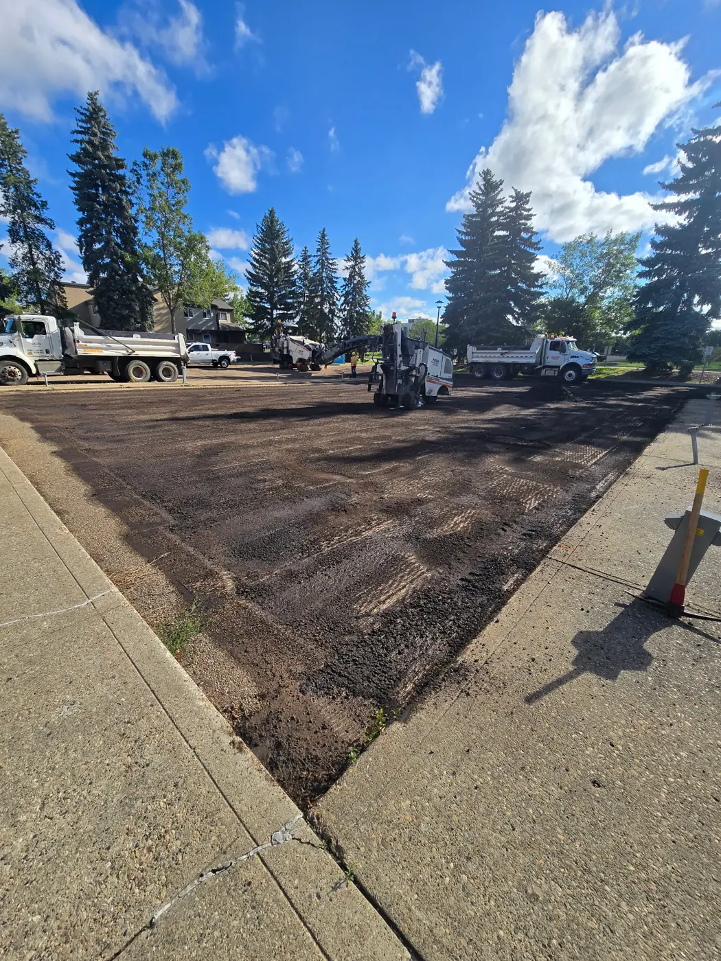 Old asphalt being milled off ahead of repaving