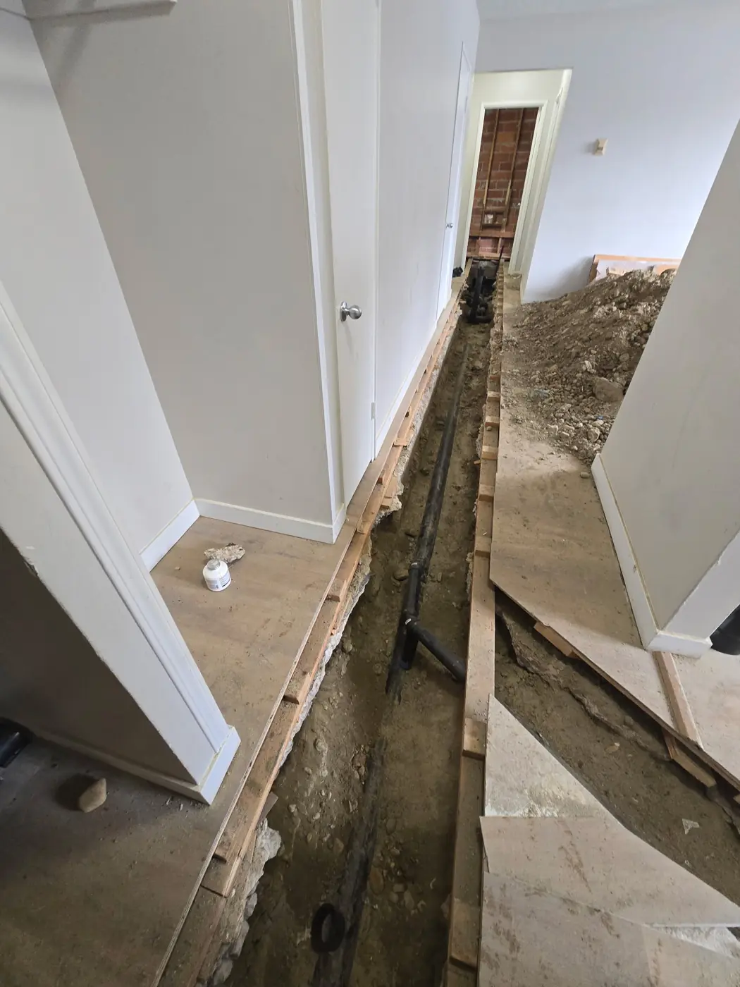 Drain trench run down a suite hallway